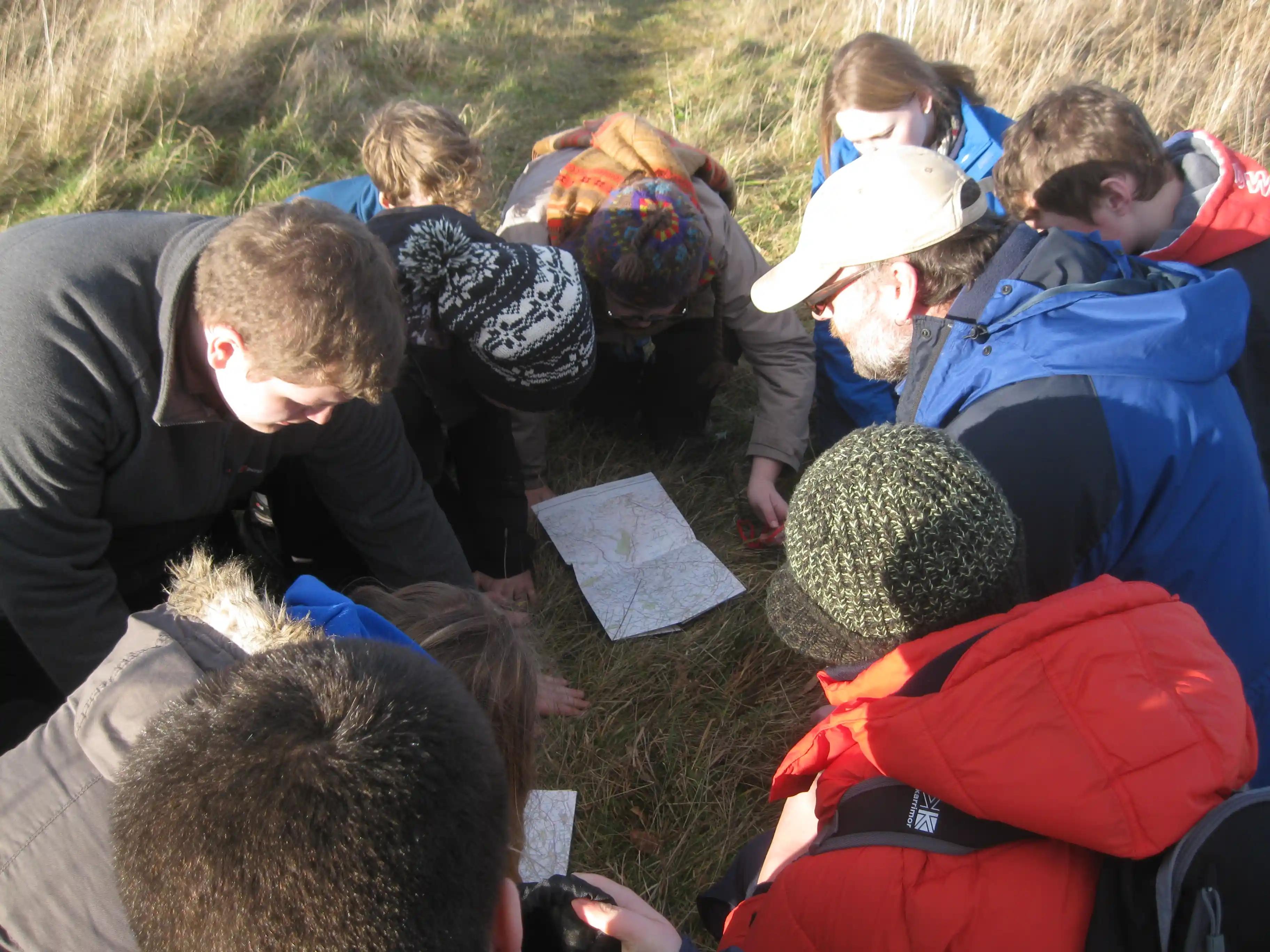 East Lothian Junior Rangers Group looking at a map