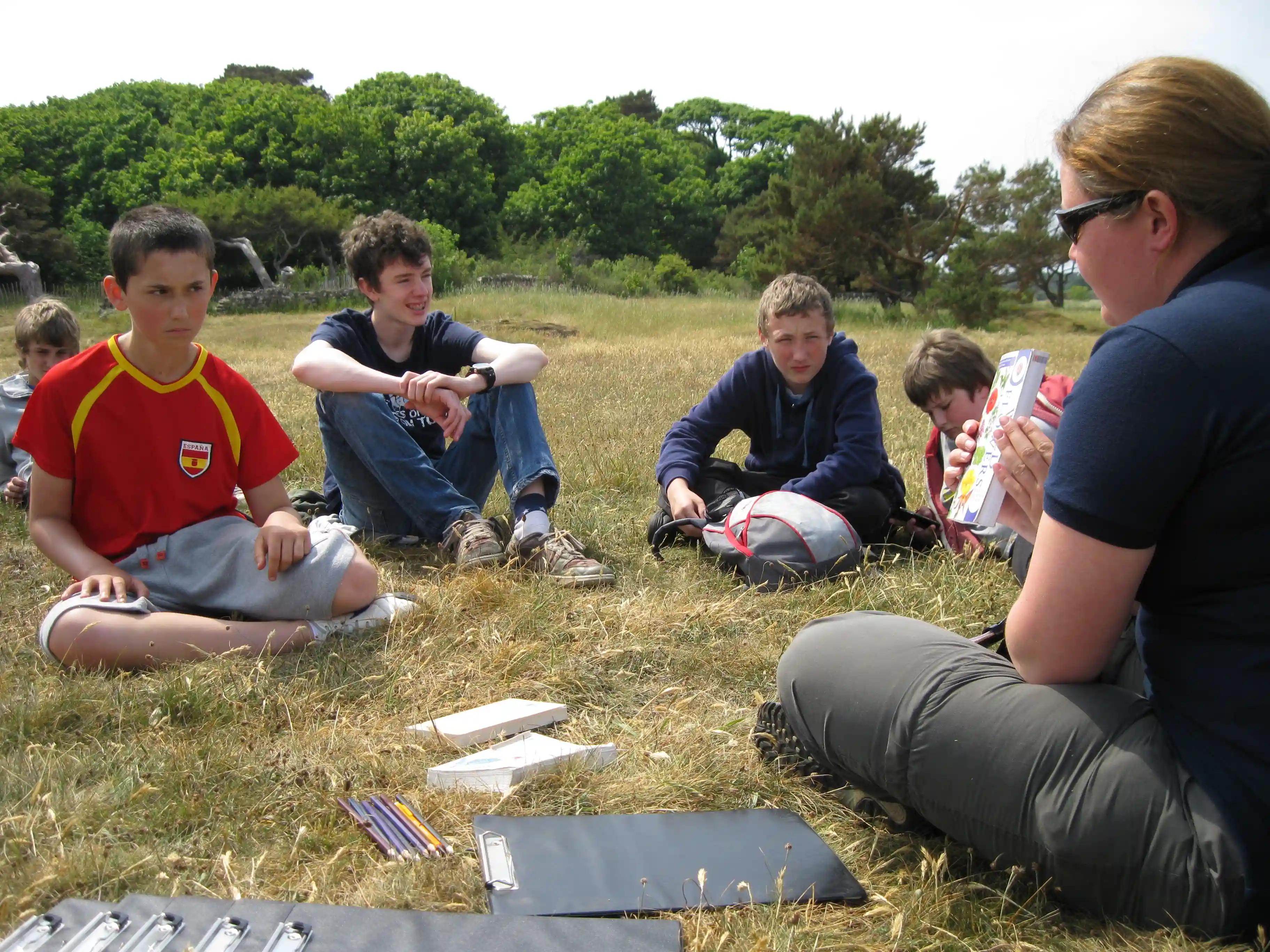 East Lothian Junior Rangers talking in a field